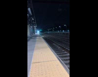 Fast regional train pass by station night