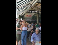 Green car revs engine scares people in picasso restaurant 