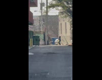 Man in a blue sweater tiktok dance on the street