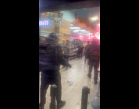 Customer and employee fighting inside the store