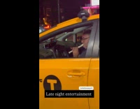 Taxi driver stuck on traffic plays flute