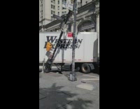 Truck knocks over streetlight making a turn 
