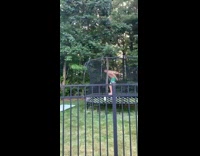 Guy jumps over trampoline net fail