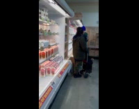 Line of people wait for eggs on shelf