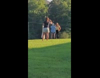 Woman film another take photos park grass