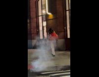 Guy piggyback girlfriend in dress crossing street