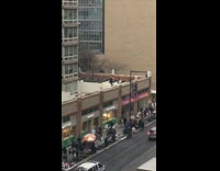 Guy on roof of rite aid practicing lightsaber