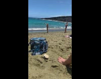 Girl takes photo on beach shore