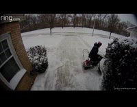 Ring camera of person tripping while dragging trash can