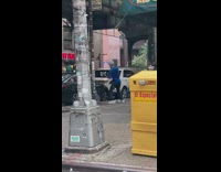 Guy seen punching on sidewalk 