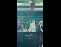 Friends watch car accident reaction on screen