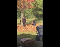 Man Throws Leaves Up for Photo