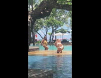 White bikini lady pool orange red flag