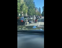 People fight on the road pull clothes