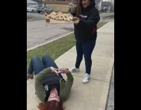 Girl on ground records falling breadsticks 