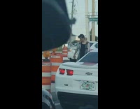 Guy stands in middle of street for photoshoot 