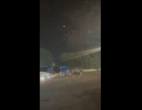 Fireworks seen by people near the bus