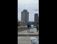 Couple Holds Hands on Hoverboards 
