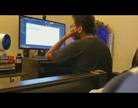 Man opens video file computer Rick Astley