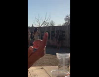 Two women black dress hug wall pictorial