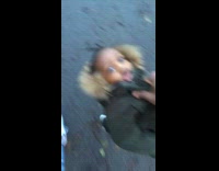 Carrying baby boy by jacket