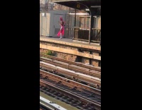 Collab WINY - Woman wearing pink dress and wig on subway