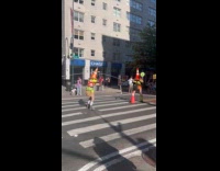 Traffic cone heads playing jump rope on crosswalk