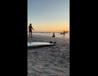 Man directs woman for her beach photo