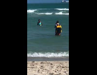 Woman blue green bikini beach waves pictorial