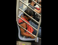 Guy slouches and sleeps on train 