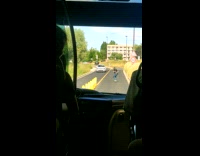 Teenager on Skateboard Bends to Speed Up