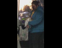 Woman blue jacket carries rabbit on her arm in the bus