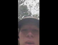 Guy in brown hat smokes 