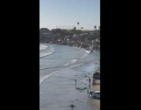 Car drives through waves at beach 
Part 2 