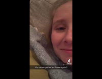 Woman on couch watching youtube loudly