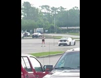 Roller skater almost falls grabbing tripod 