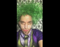 Guy dresses up in The Joker costume and says ay papi with wind blowing through hair