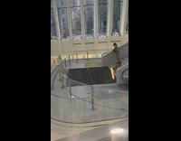 Woman white robe towel hotel stairs glass