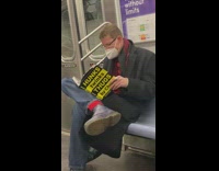 Guy reads hunks twinks thugs book on subway