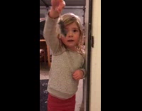 Girl shows parents mouse she just caught