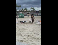 Woman black outfit dance bone fire beach