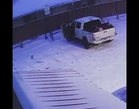 Man gets out of truck and slips on snow