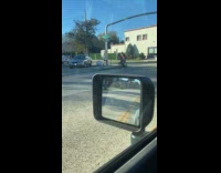 Man Santa Claus costume ride bike on street