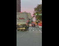 Man hold on to the truck with his skateboard in NY 