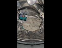 Woman show money unbreakable money from washing machine