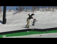 Guy grinds a rail with his skis, flips side to side, and falls on the third jump