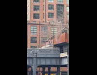 Person lays on back with legs raised 