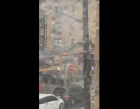 Power lines burn with fire from storm 