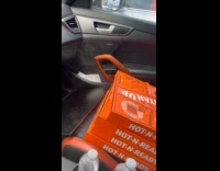 Newly cooked pizza with steam coming out from box