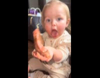 Toddler munching on steak